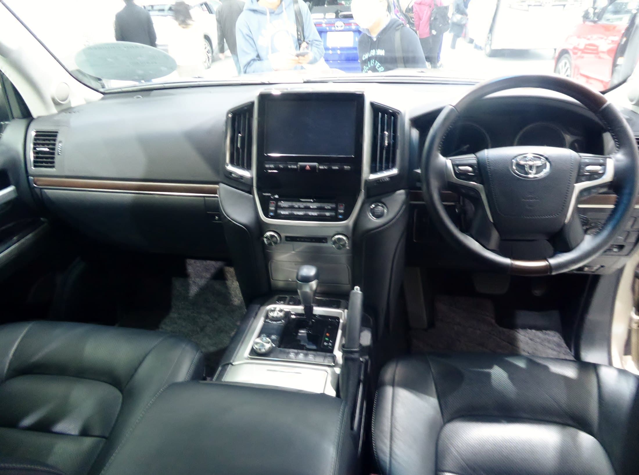 The leather cabin of a chauffeur-driven Land Cruiser